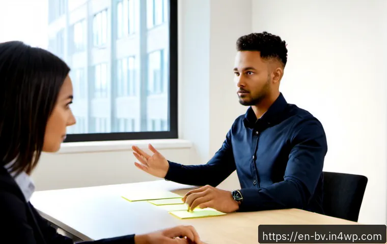 Home 17 커뮤니케이션 오류 방지를 위한 팁 - Photorealistic modern office meeting, two diverse coworkers seated across a clean table, one calmly ...